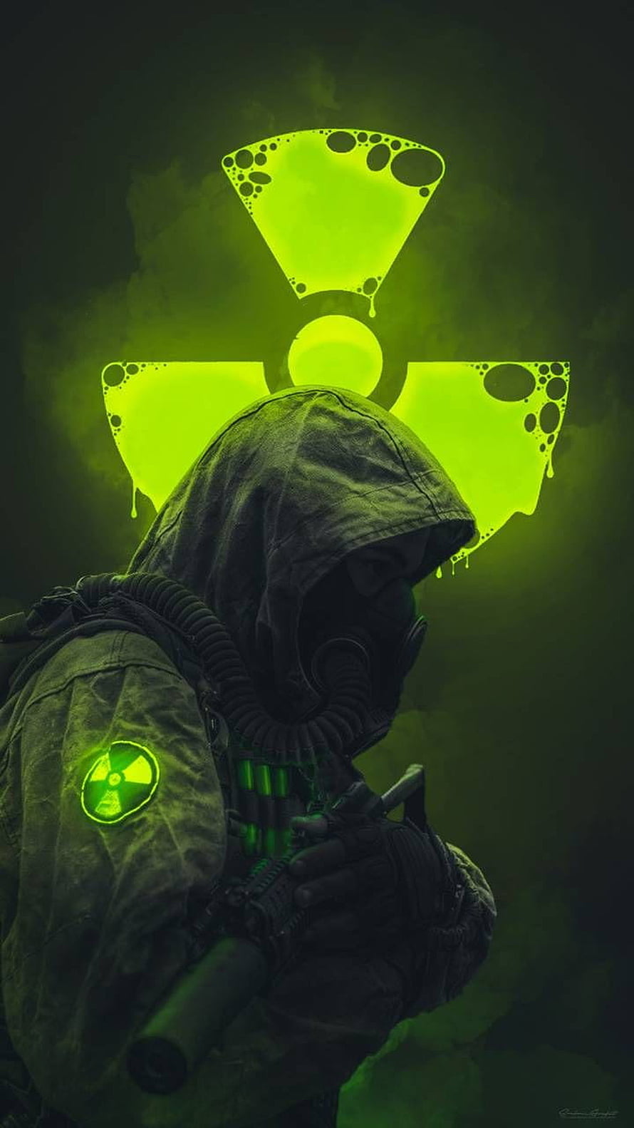 Hooded Soldier in Gas Mask with Glowing Radioactive Symbol and Toxic Green Atmosphere HD phone wallpaper