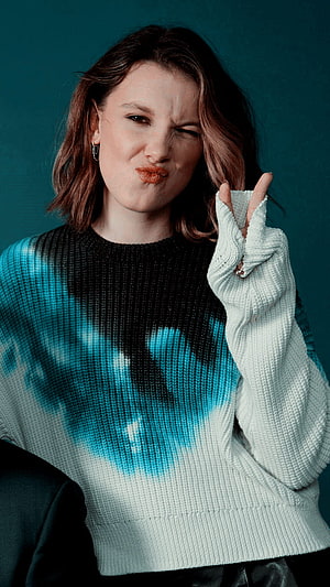 Millie Bobby Brown Playful Portrait in Tie-Dye Knit Sweater HD phone wallpaper