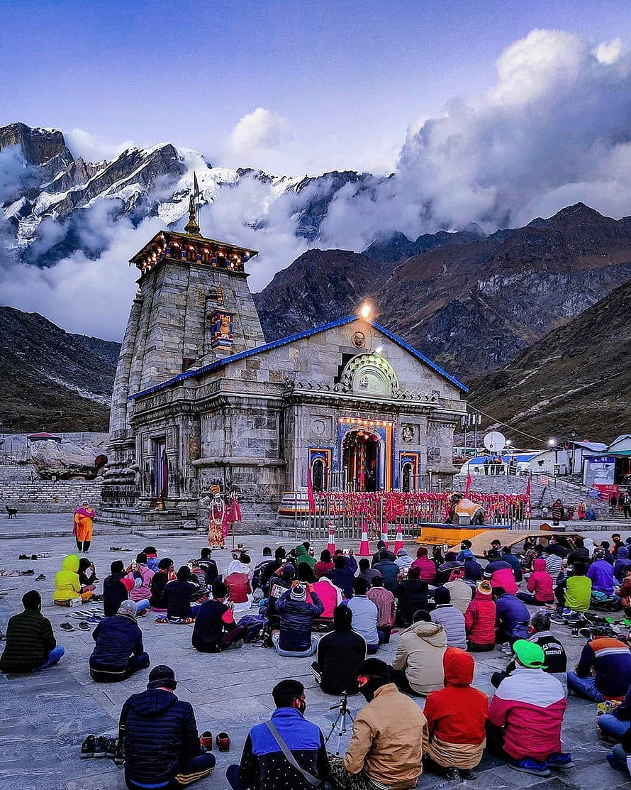 Kedarnath Temple in the Himalayas with devotees praying at dawn HD phone wallpaper