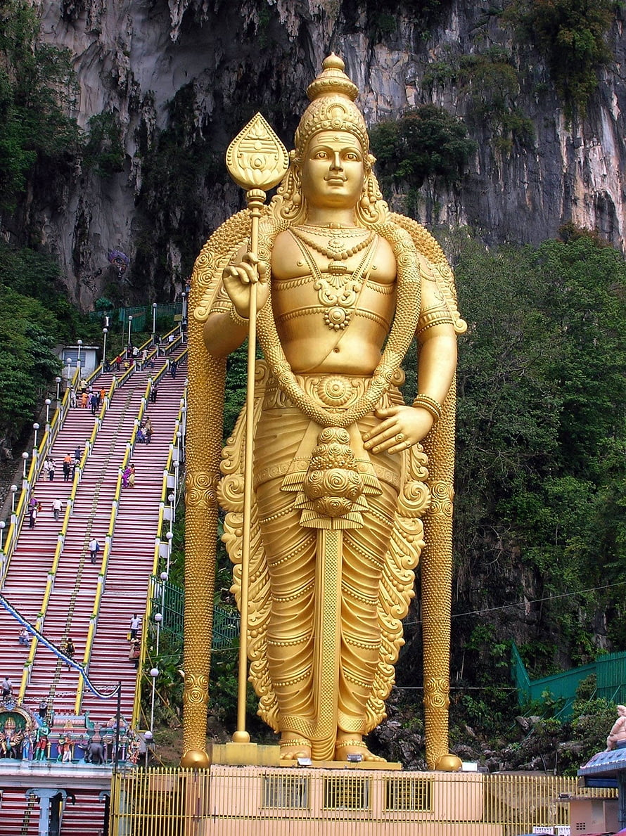 Lord Murugan Golden Statue at Batu Caves with Iconic Staircase and Limestone Cliffs HD phone wallpaper