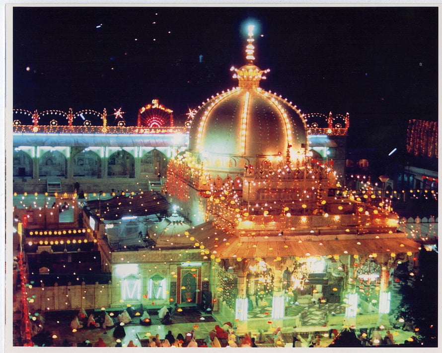 Ajmer Sharif Dargah illuminated at night with golden dome and festive lights HD wallpaper