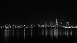 Monochrome City Skyline at Night with Water Reflections HD wallpaper