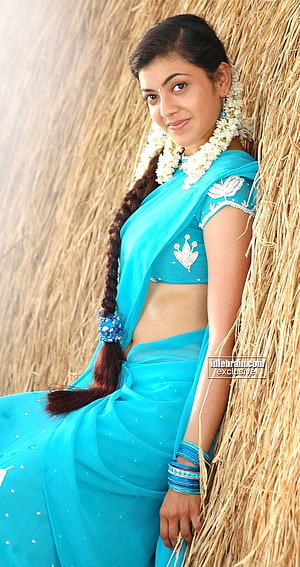 Kajal Agarwal in a turquoise sari with jasmine garland and long braid HD phone wallpaper