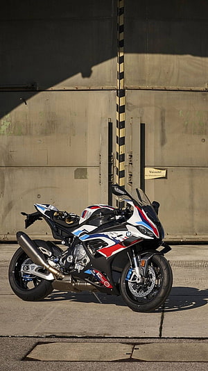 BMW M 1000 RR Superbike with M Motorsport Livery Parked on Concrete HD phone wallpaper