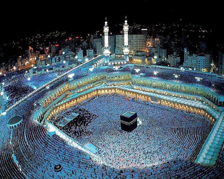 Aerial Night View of Kaaba in Mecca with Crowds Performing Tawaf HD wallpaper
