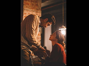 Tamasha Movie Still: Intimate Moment Between Two Characters in Warm Dim Lighting HD wallpaper