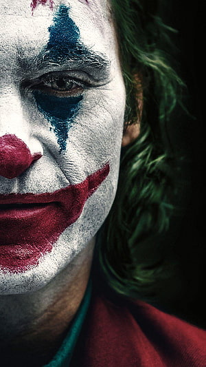 Joker Character Close-Up Portrait With Clown Makeup And Green Hair HD phone wallpaper