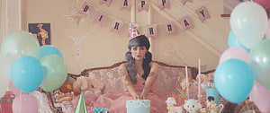 Melanie Martinez Birthday Party Scene With Pastel Balloons And Vintage Sofa HD wallpaper