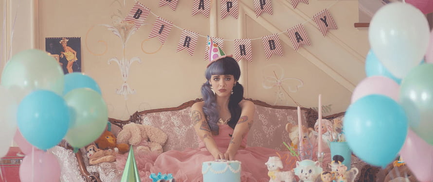Melanie Martinez Birthday Party Scene With Pastel Balloons And Vintage Sofa HD wallpaper