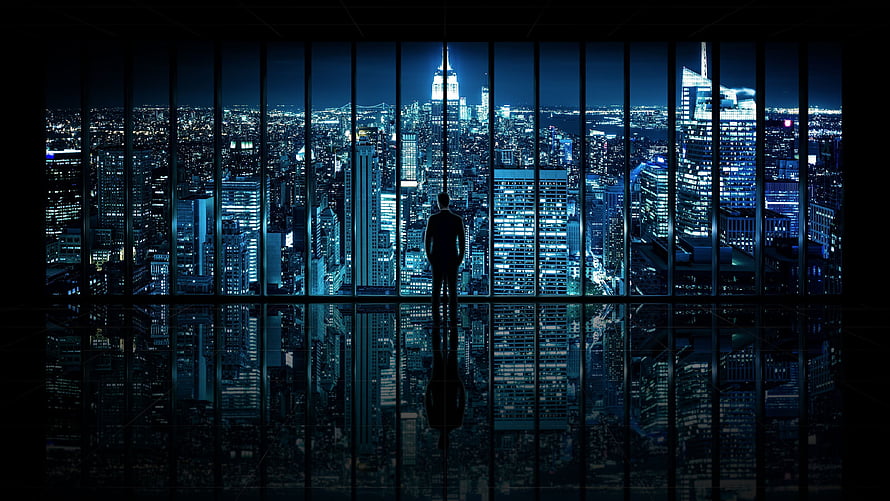 Silhouette of a businessman standing in a high-rise office overlooking a glowing blue city skyline at night, Ultra Windows, windows ultra HD wallpaper
