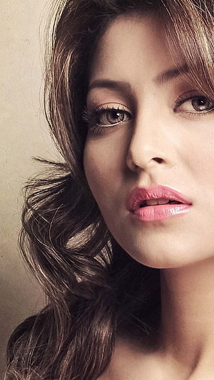 Urvashi Rautela Close-Up Portrait with Wavy Hair and Soft Studio Lighting HD phone wallpaper