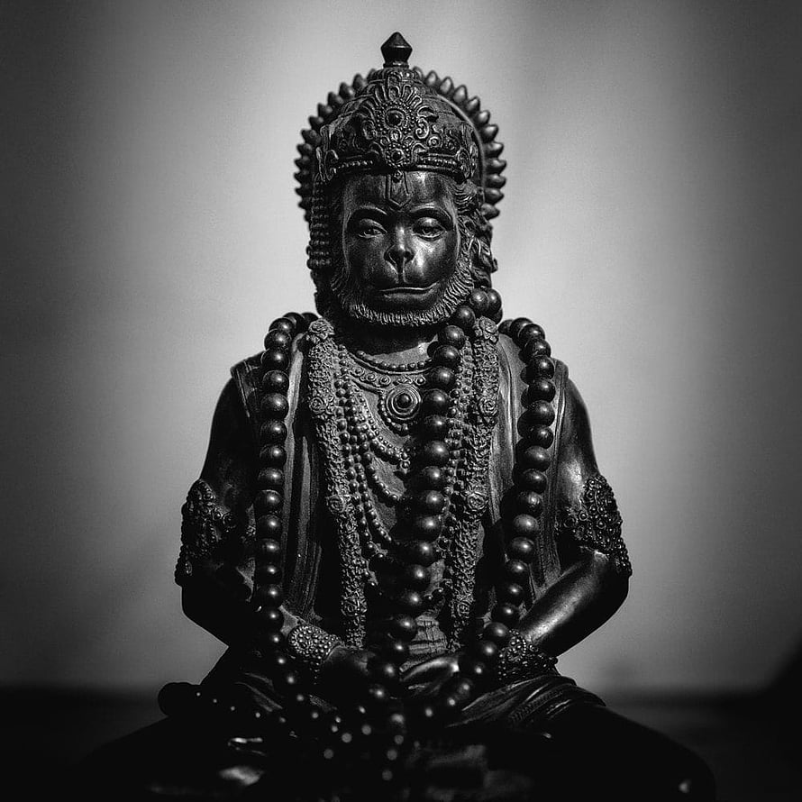 Black and White Portrait of a Monkey King Statue with Intricate Crown and Beads HD phone wallpaper