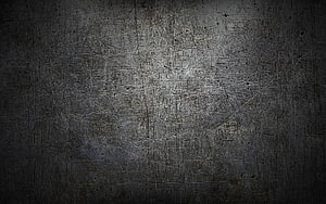 Dark Scratched Metal Texture with Industrial Grunge and Vignette Effect HD wallpaper