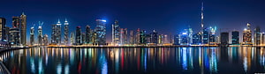 Doha Qatar Skyline at Night with Burj Doha Tower and Waterfront Reflections HD wallpaper