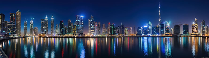 Doha Qatar Skyline at Night with Burj Doha Tower and Waterfront Reflections HD wallpaper