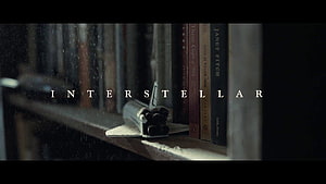Interstellar Movie Scene Featuring Model Spaceship on Dusty Bookshelf HD wallpaper