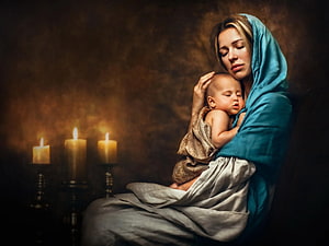Serene Mother and Child Portrait with Blue Veil and Candles HD wallpaper