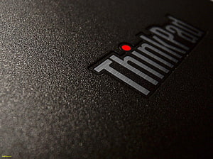 Lenovo ThinkPad Logo Close-Up on Textured Black Laptop Surface HD wallpaper