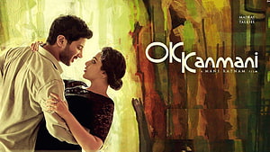 Ok Kanmani Movie Poster Featuring Romantic Couple Embrace Against Painted Background HD wallpaper