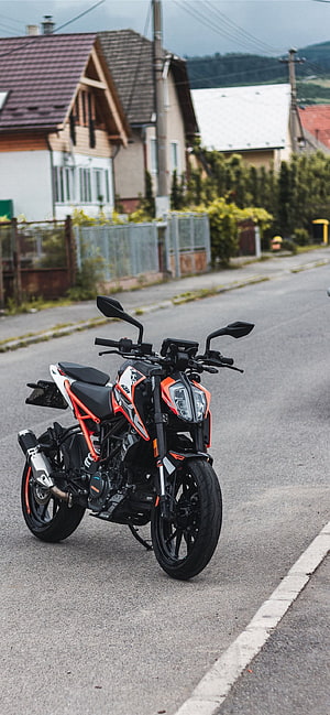 KTM Duke 390 Street Motorcycle Parked on a Quiet Residential Road HD phone wallpaper