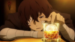 Dazai Osamu from Bungou Stray Dogs resting beside a glowing whiskey glass in a dimly lit room HD wallpaper