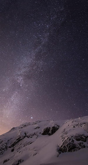 Stunning Milky Way Galaxy Over Snowy Mountain Peaks at Night HD phone wallpaper