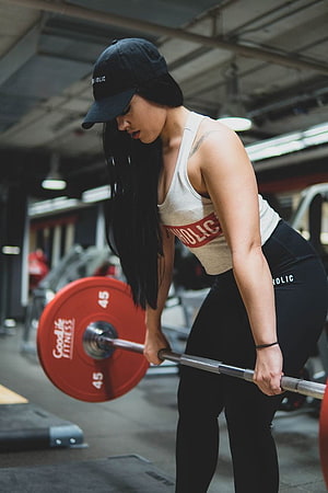 Woman performing a barbell deadlift in a commercial gym wearing athletic wear, Gym Outfits For Women in 2020, women gym workout HD phone wallpaper