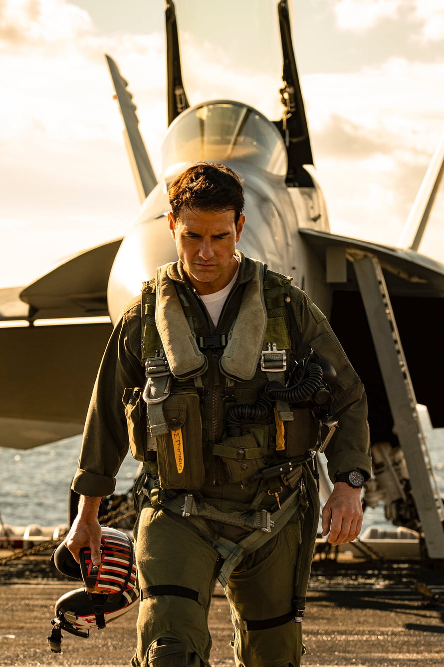 Top Gun Maverick Pilot Walking on Aircraft Carrier Deck with F-14 Fighter Jet HD phone wallpaper