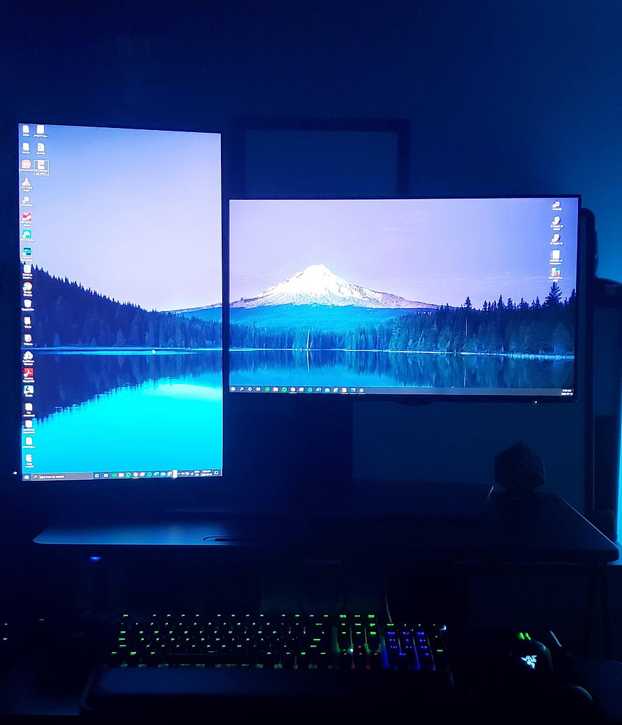 Dual Monitor Gaming Setup With Blue Backlight And Mountain Lake Wallpaper HD phone wallpaper