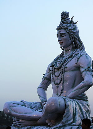 Majestic Blue Statue of Lord Shiva in Meditation Pose with Crescent Moon and Serpent HD phone wallpaper