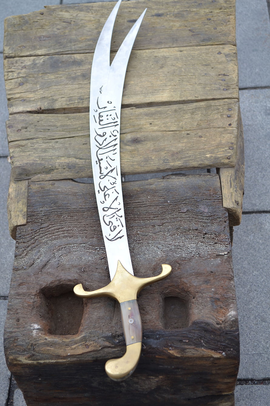 Ornate Tulwar Sword with Arabic Calligraphy on Blade and Brass Hilt HD phone wallpaper