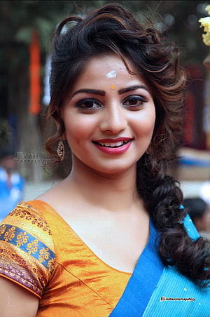 Rachita Ram in a vibrant blue and gold sari with traditional bindi and elegant updo hairstyle HD phone wallpaper