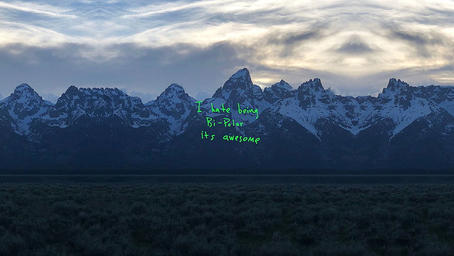 Snowy Mountain Range at Dusk with Green Text Overlay HD wallpaper