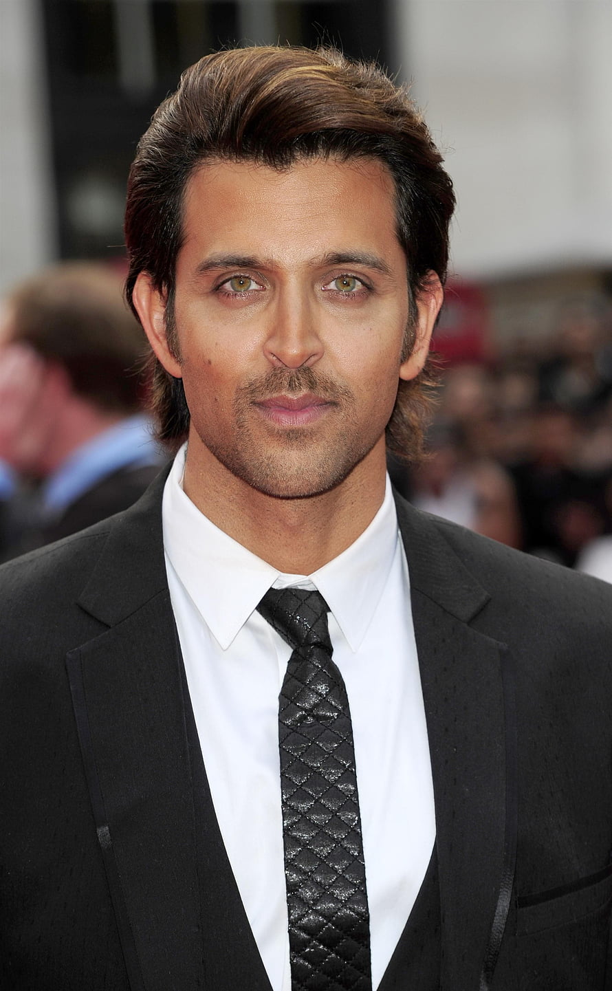 Hrithik Roshan in a black suit and textured tie at a formal red carpet event HD phone wallpaper