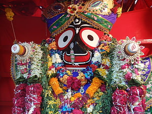 Colorful Kali Maa idol adorned with flowers and jewelry for Durga Puja festival celebration HD wallpaper