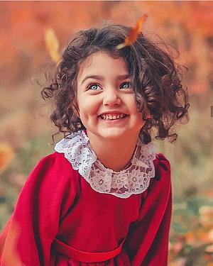 Anahita Hashemzadeh in a red dress with a white lace collar against an autumn background HD phone wallpaper