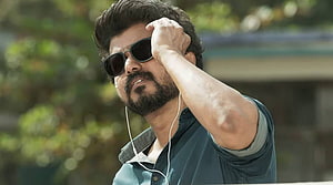 Vijay in Master as a rugged teacher wearing sunglasses and earphones HD wallpaper
