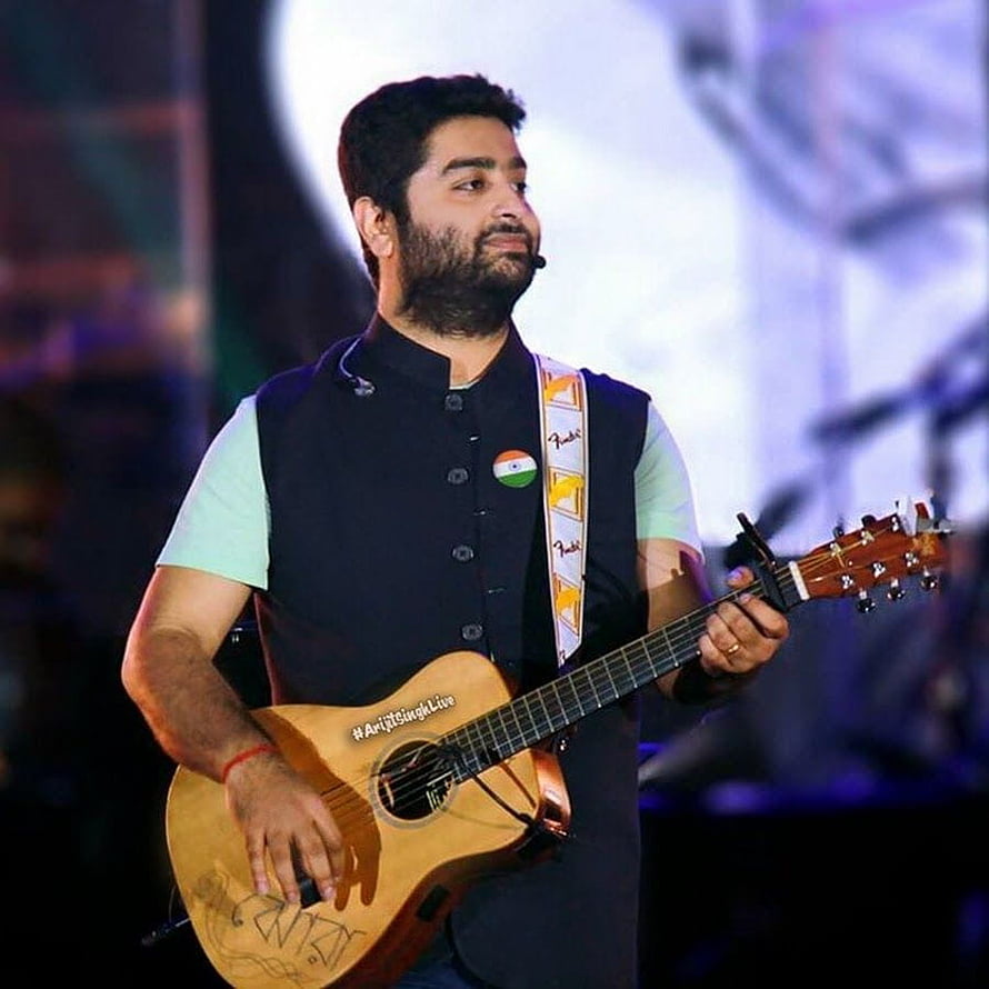 Arijit Singh performing live on stage playing acoustic guitar HD phone wallpaper