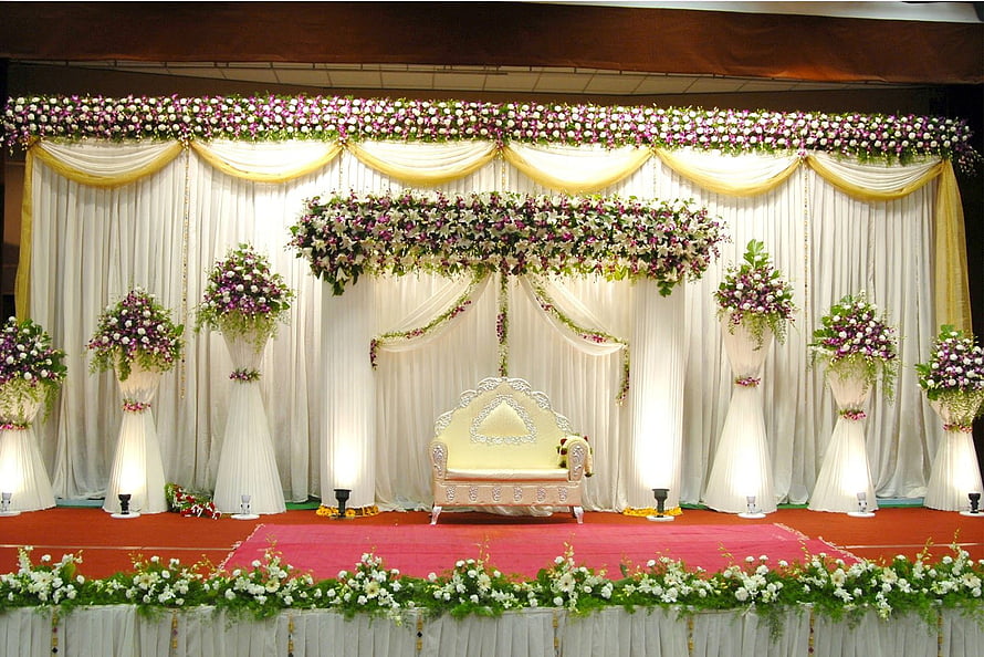 Elegant Indian Wedding Stage Decor with Floral Arrangements and Traditional Sofa HD wallpaper