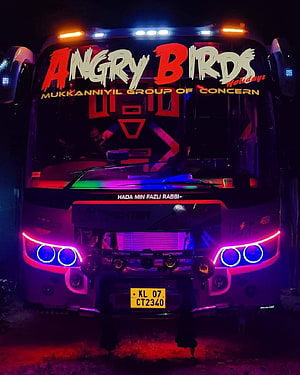 Angry Birds Holidays bus with vibrant neon LED lights and custom front grille design HD phone wallpaper