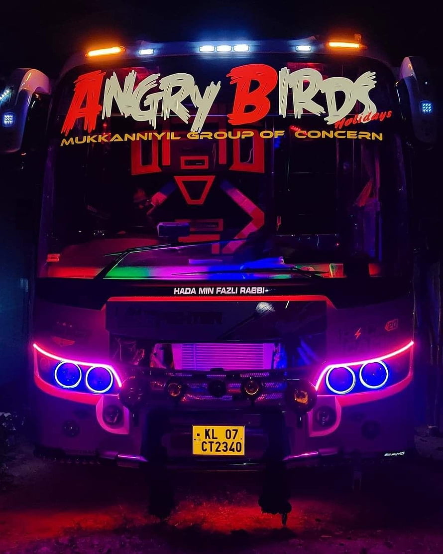 Angry Birds Holidays bus with vibrant neon LED lights and custom front grille design HD phone wallpaper