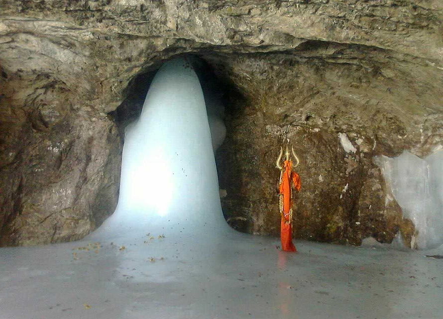 Amarnath Cave Interior with Sacred Ice Stalactite and Orange Statue in Jammu Kashmir HD wallpaper