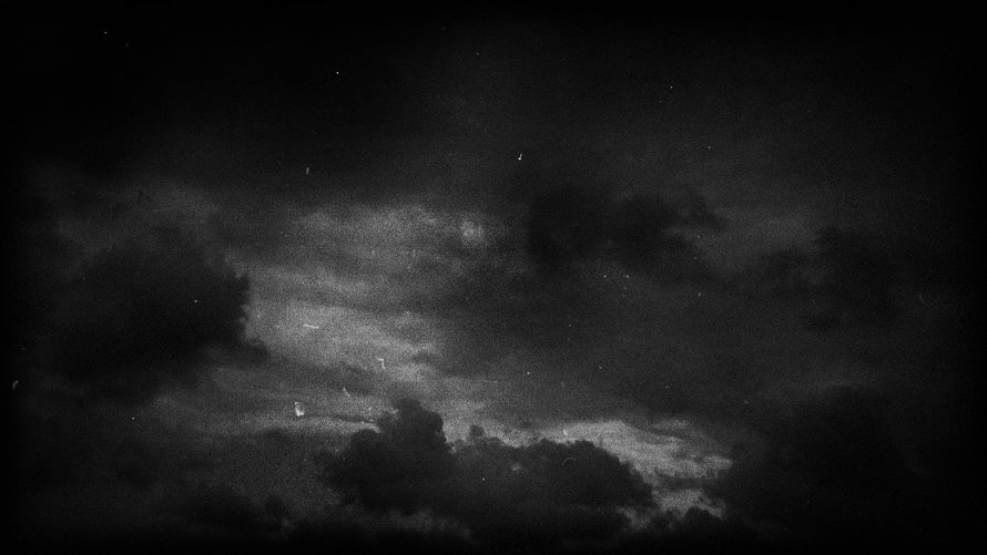 Moody Dark Grey Clouds with Subtle Moonlight and Vintage Film Grain HD wallpaper