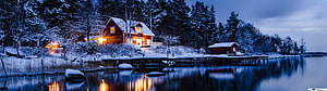 Cozy Red Cabin by Frozen Lake at Twilight with Snowy Forest and Warm Light Reflections HD wallpaper