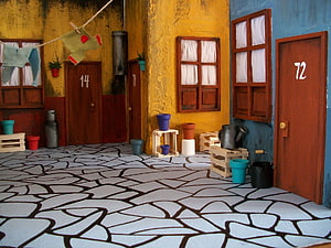 Miniature Model Village Street Scene with Colorful Doors and Cobblestone Path HD wallpaper