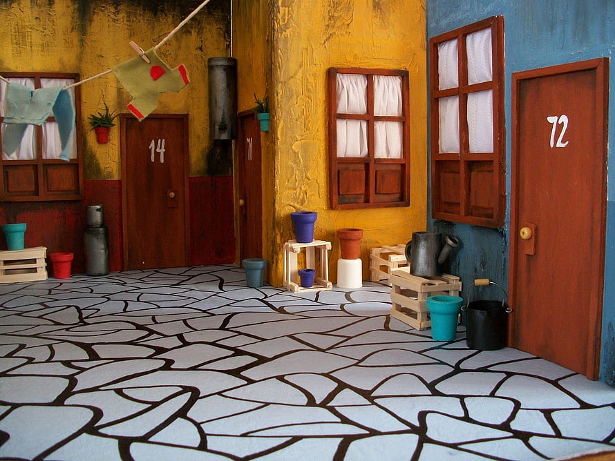 Miniature Model Village Street Scene with Colorful Doors and Cobblestone Path HD wallpaper