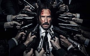 John Wick Surrounded by Guns in Suit HD wallpaper