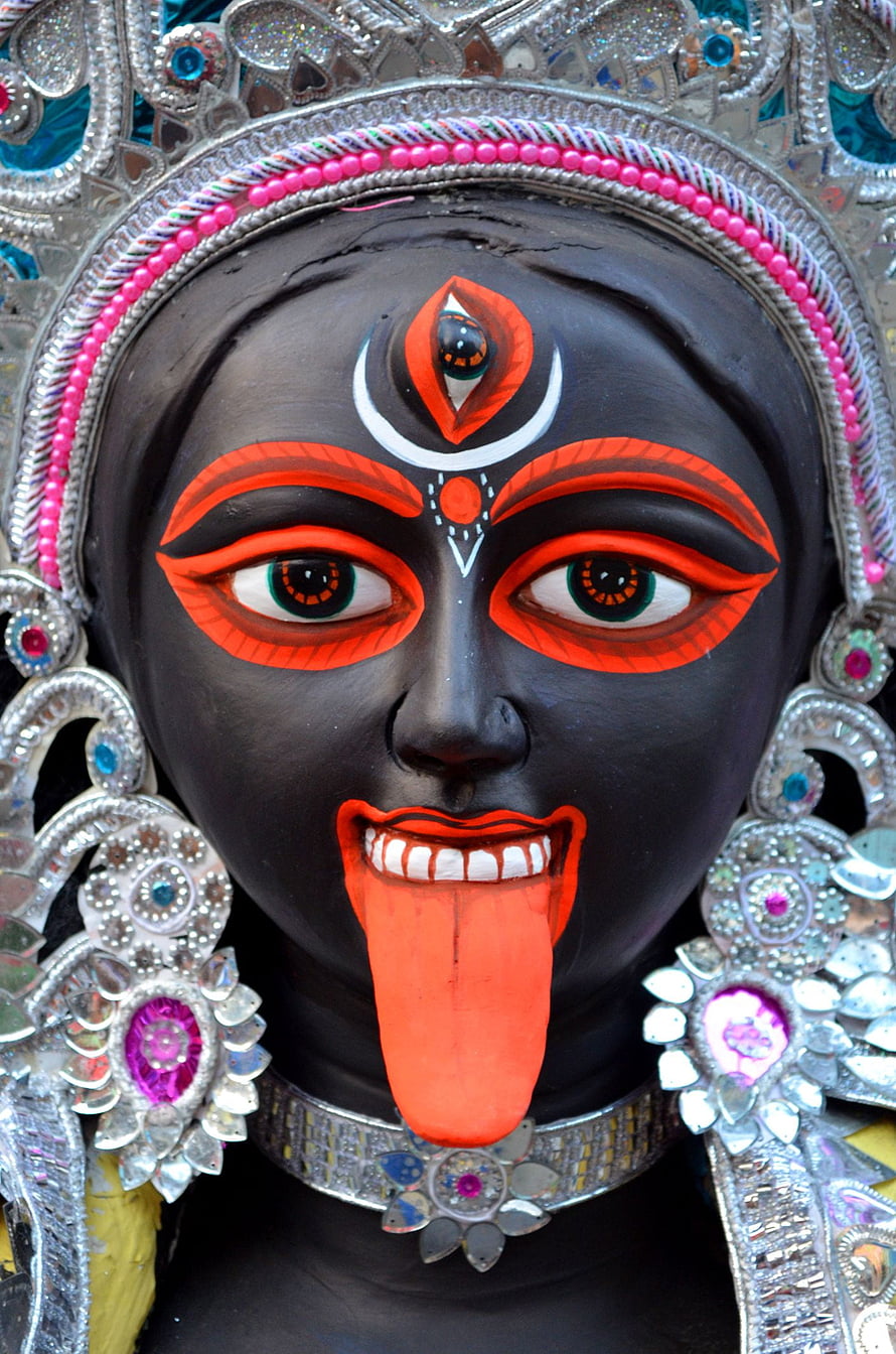 Tara Maa Hindu Deity Statue with Black Face, Red Tongue, and Ornate Silver Headdress HD phone wallpaper