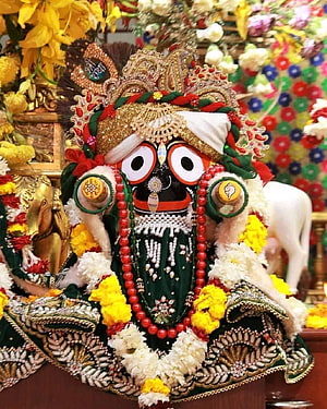 Colorful depiction of Lord Jagannath adorned with flowers and jewelry HD phone wallpaper