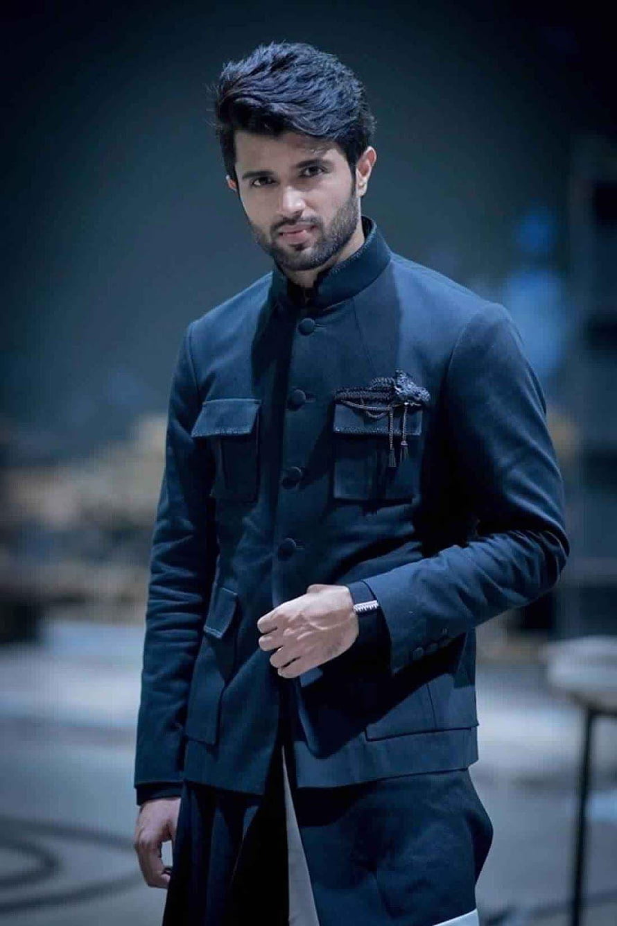 Vijay Devarakonda in a dark mandarin collar jacket with a serious expression HD phone wallpaper